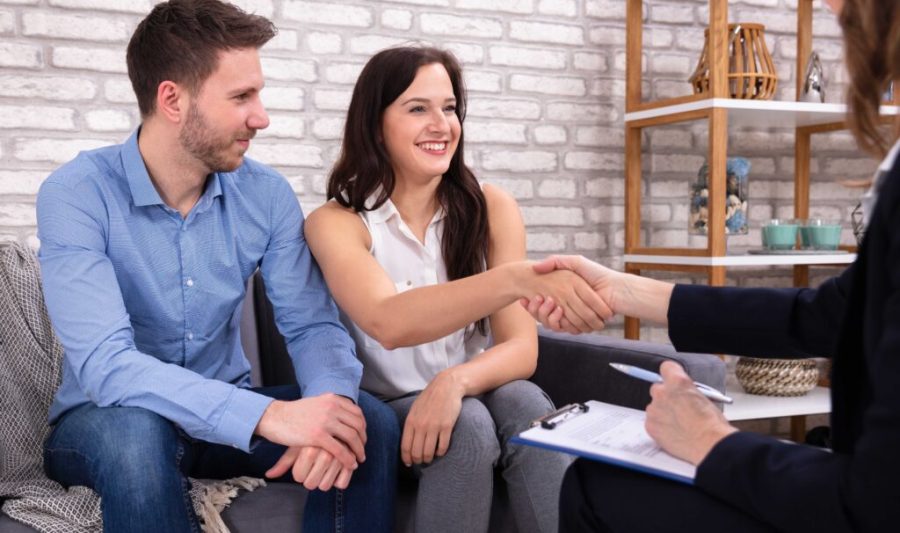 Happy Woman Handshaking With Helpful Psychologist At Home
