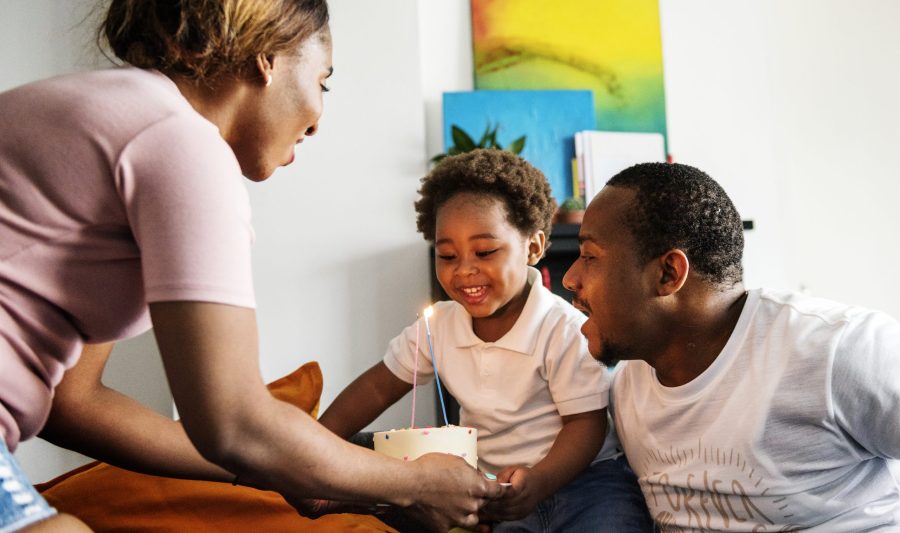 mom-bringing-birthday-cake-her-child