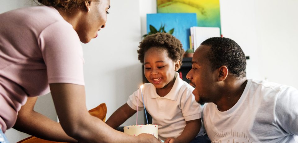 mom-bringing-birthday-cake-her-child